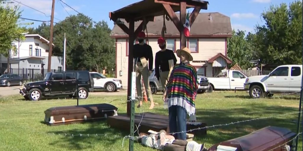 Halloween display with hanging figures in MAGA-style hats fuels debate over immigration, free speech