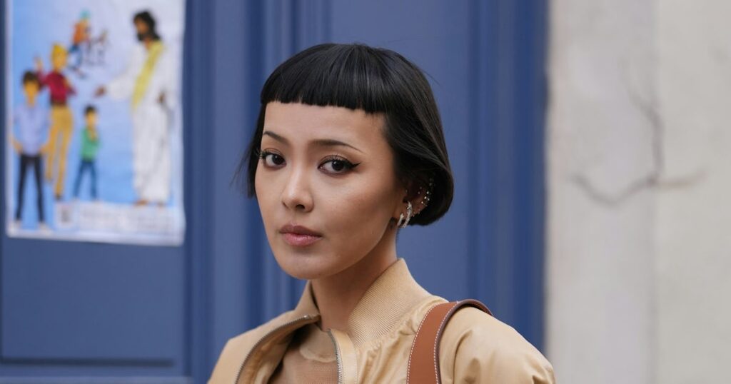 Blunt Bangs Are Spotted All Over Paris Fashion Week Spring/Summer 2026's Street Style Crowd